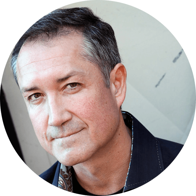 Cash Offer's Brad Levang; headshot with paisley blue shirt and navy jacket