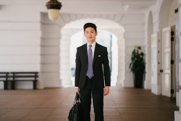 a business man in a suit with a suitcase, highlighting new business opportunities